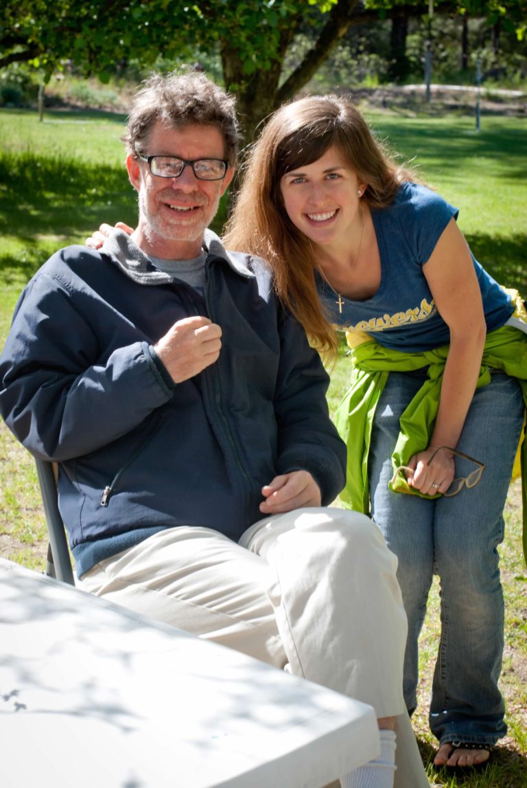 woman and man with a disability smiling next to each other