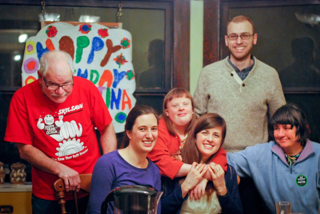 group of people with and without disabilities smiling