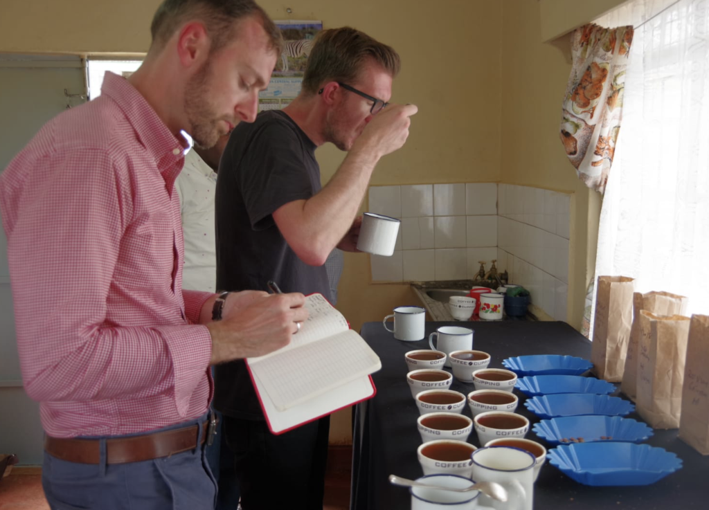 Two men tasting coffee